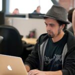 programmer reviewing code on a monitor