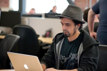 programmer reviewing code on a monitor