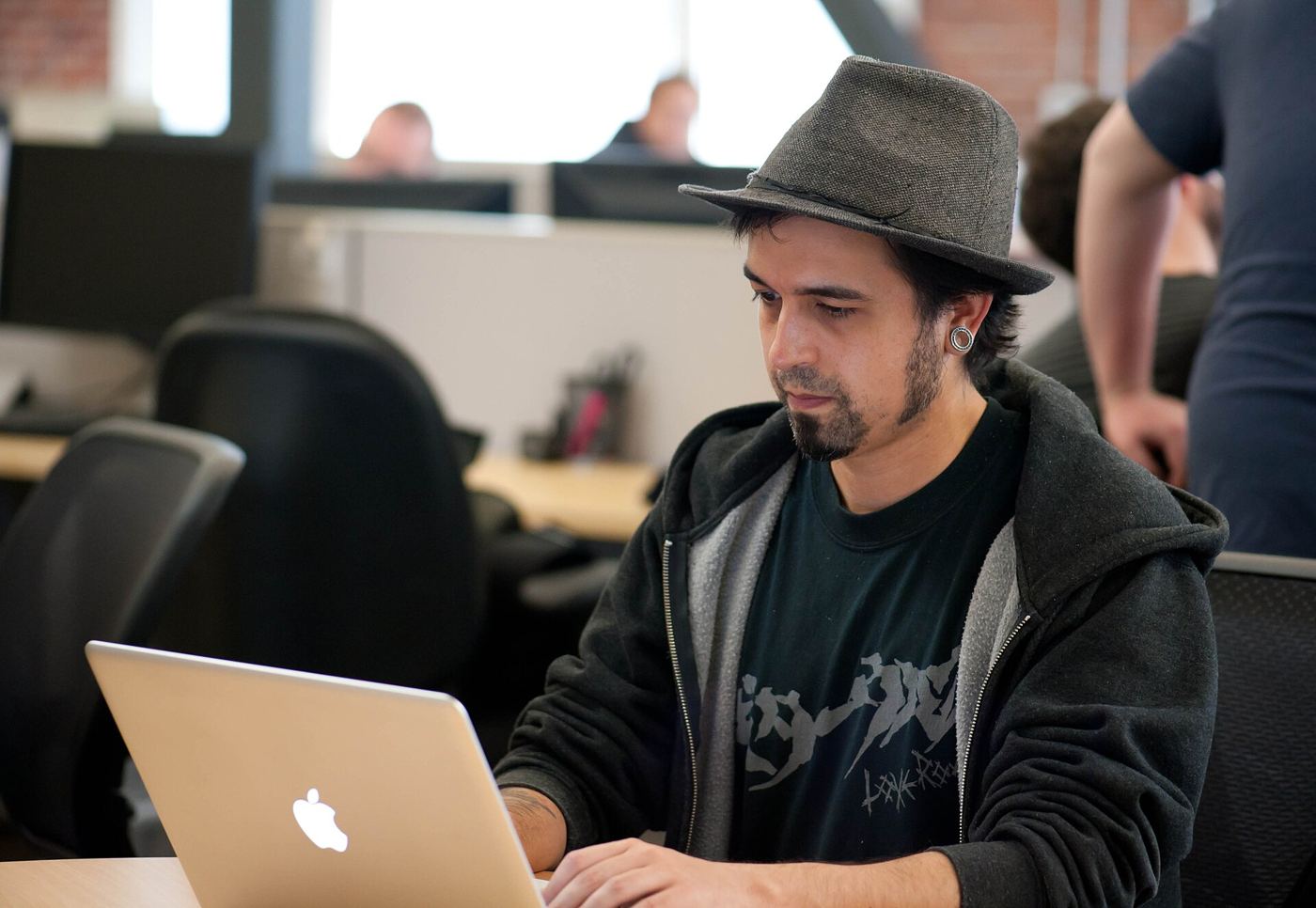 programmer reviewing code on a monitor